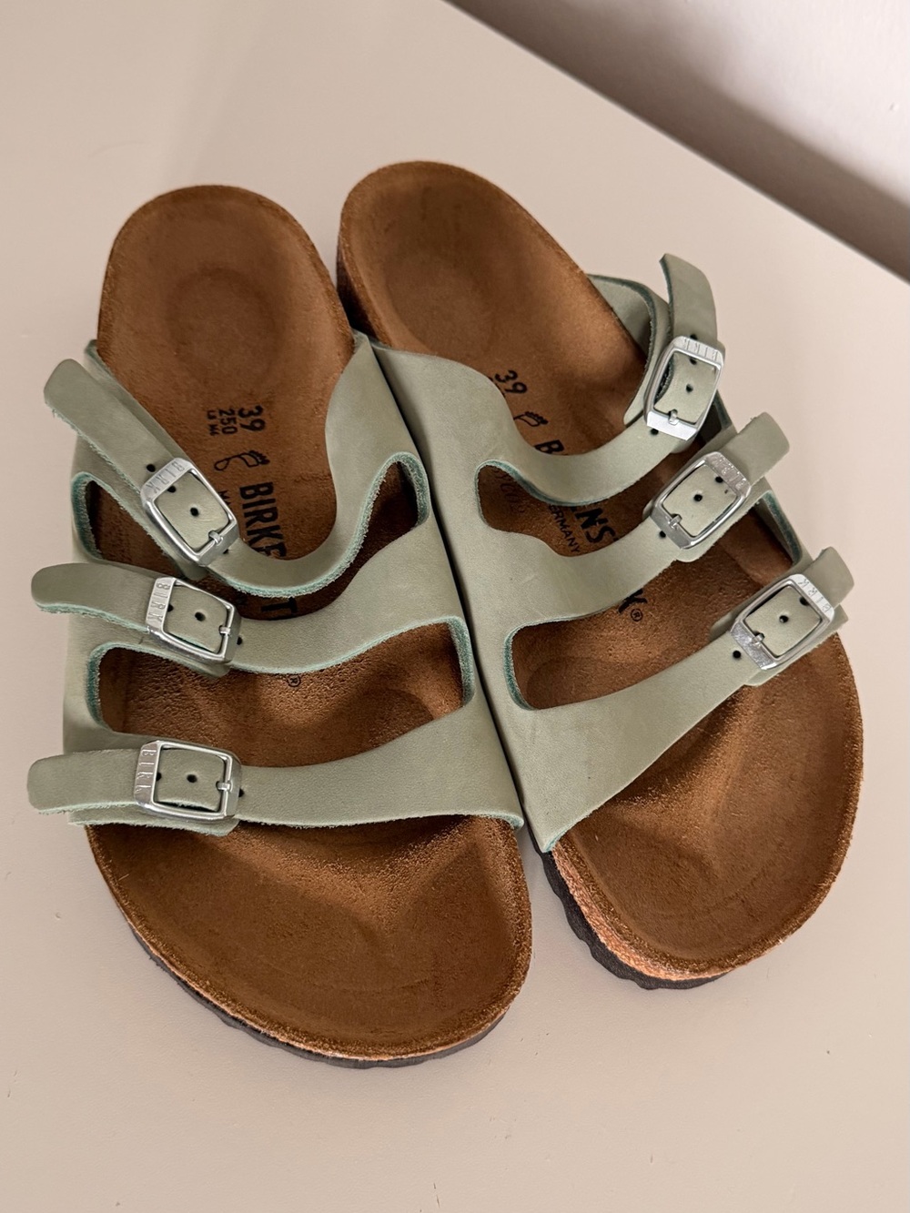 Beach ready Birkenstock Triple-Strap Sandals in Light Sage for coastal style